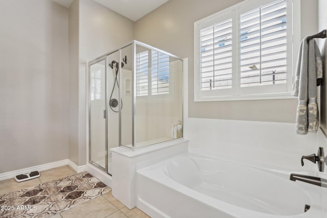 bathroom with tile patterned flooring and plus walk in shower