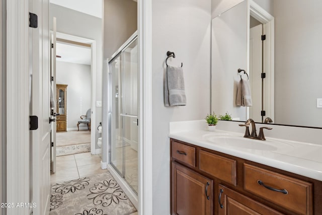 bathroom with vanity, tile patterned floors, and walk in shower