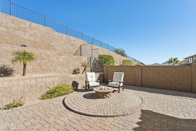 view of patio / terrace featuring a fire pit