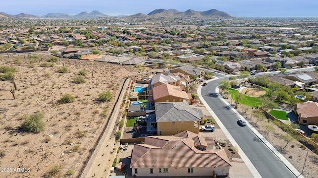 birds eye view of property featuring a mountain view