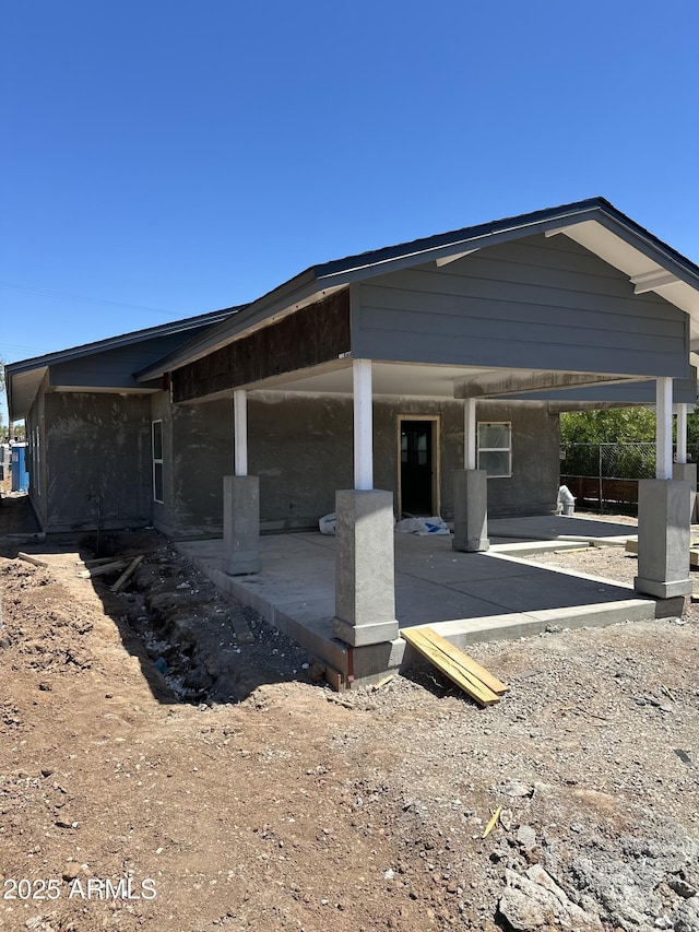 1210 E Garfield St, Phoenix, AZ 85006 - view of side of property with a patio area