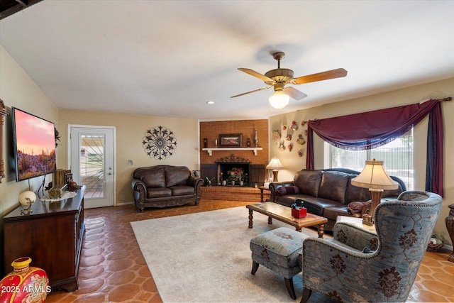 23265 S Via Del Arroyo, Queen Creek, AZ 85142 - living area with plenty of natural light, a ceiling fan, a brick fireplace, tile patterned floors, and recessed lighting