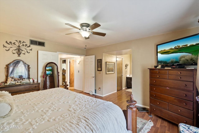 23265 S Via Del Arroyo, Queen Creek, AZ 85142 - bedroom featuring wood finished floors, baseboards, ceiling fan, and ensuite bathroom