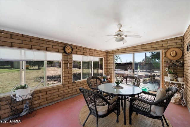 23265 S Via Del Arroyo, Queen Creek, AZ 85142 - sunroom / solarium with brick wall, ceiling fan, and outdoor dining space