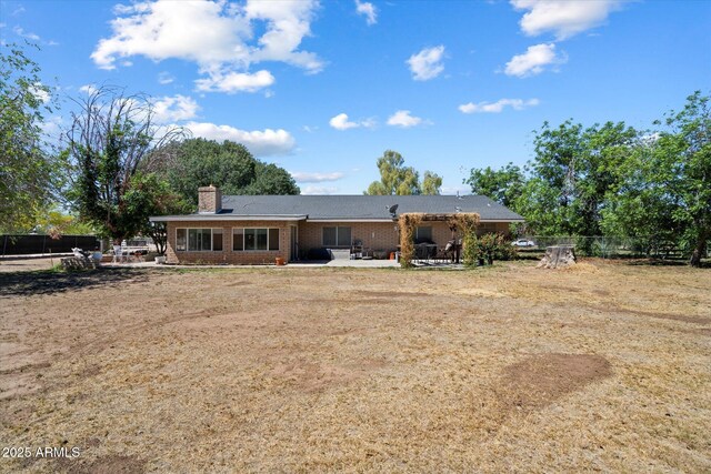 23265 S Via Del Arroyo, Queen Creek, AZ 85142 - back of property featuring a patio area, a chimney, and brick siding
