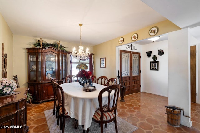 23265 S Via Del Arroyo, Queen Creek, AZ 85142 - dining area with a chandelier and stone finish floors