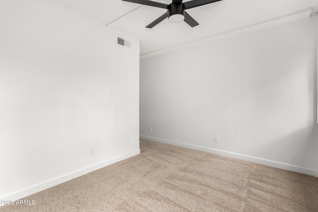 empty room featuring ceiling fan and carpet flooring