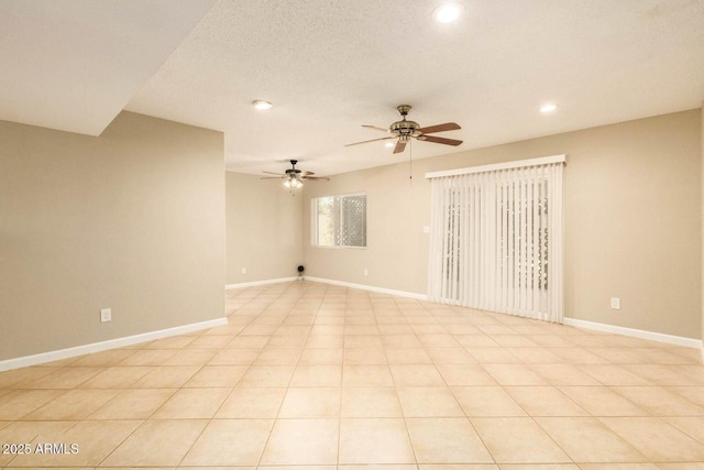 unfurnished room with baseboards, ceiling fan, and recessed lighting