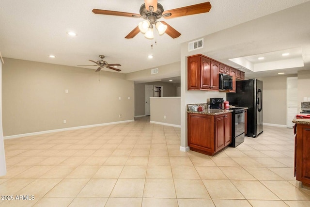 kitchen featuring ceiling fan, baseboards, black appliances, and recessed lighting