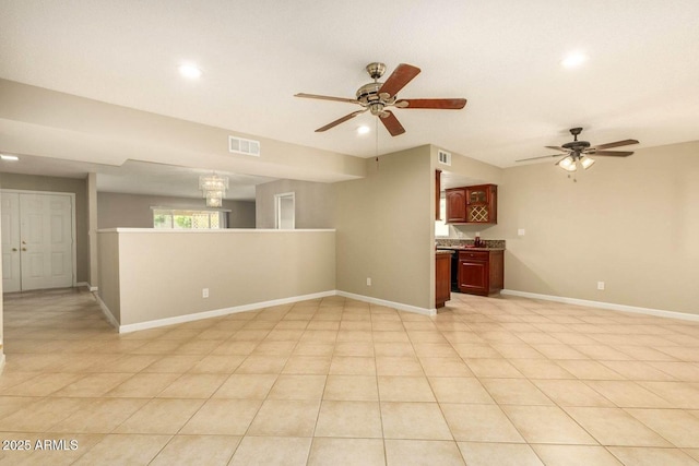 unfurnished living room featuring ceiling fan, baseboards, visible vents, and recessed lighting