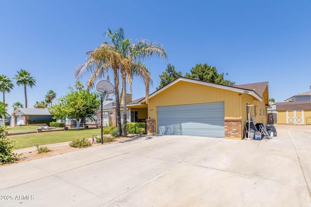ranch-style house with an attached garage, concrete driveway, brick siding, and a front lawn