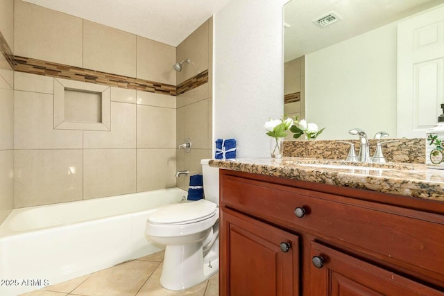 full bath featuring shower / tub combination, toilet, vanity, visible vents, and tile patterned floors