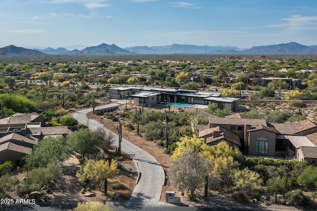 birds eye view of property with a mountain view