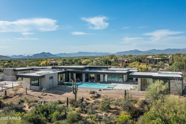 rear view of house with a mountain view