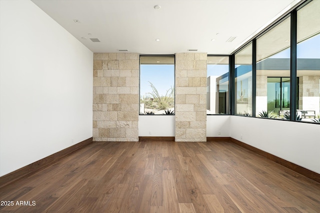 unfurnished room featuring wood-type flooring