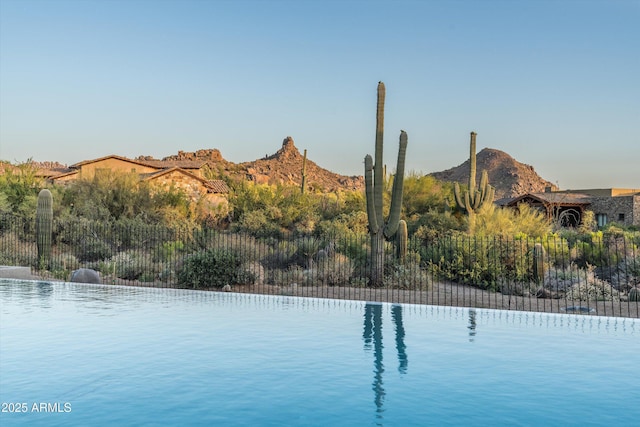 view of swimming pool featuring a mountain view