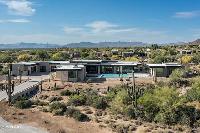 back of property featuring a mountain view