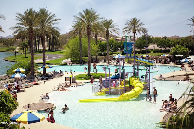 exterior space featuring a playground and a water slide