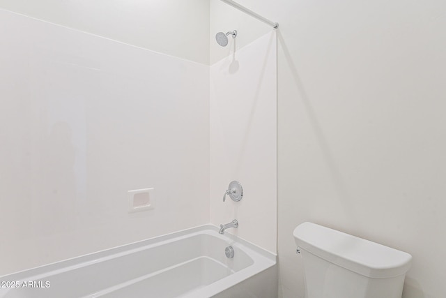 bathroom featuring toilet and shower / bathing tub combination