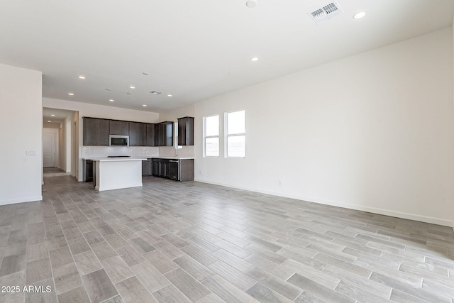 unfurnished living room with light hardwood / wood-style flooring