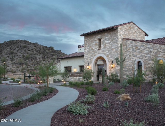 mediterranean / spanish house with a mountain view