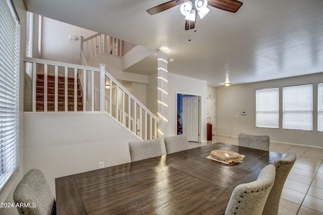 dining room with light tile patterned floors and ceiling fan