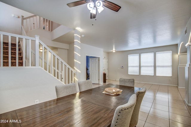 tiled dining room with ceiling fan