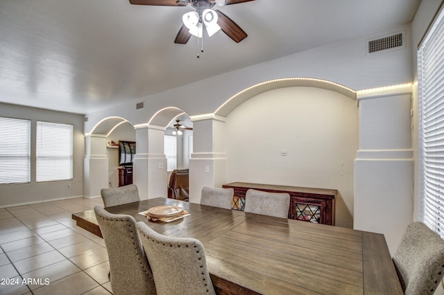 dining space featuring light tile patterned flooring, plenty of natural light, and ceiling fan