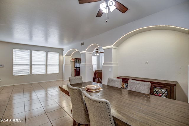 dining space featuring light tile patterned flooring and ceiling fan