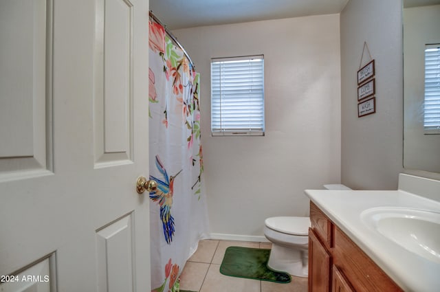 bathroom with vanity, tile patterned flooring, and toilet