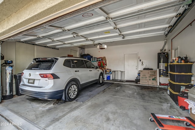 garage with a garage door opener and water heater