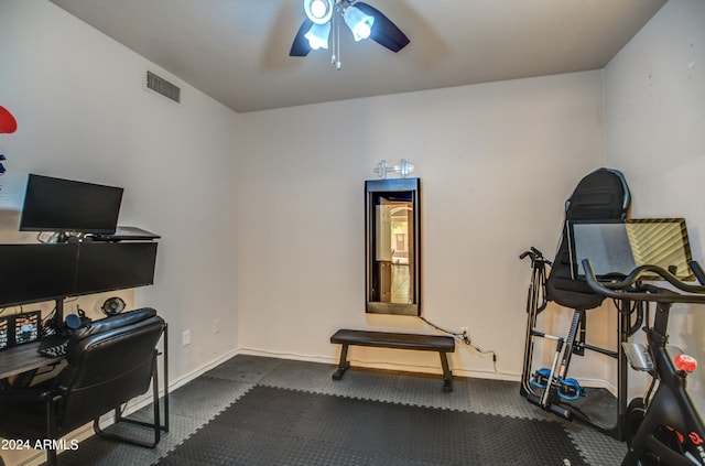 workout room with carpet floors and ceiling fan