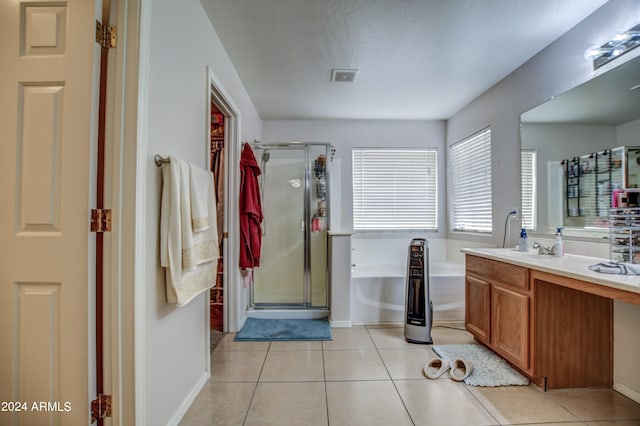 bathroom featuring vanity, tile patterned flooring, and independent shower and bath