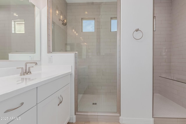 full bath featuring a stall shower and vanity