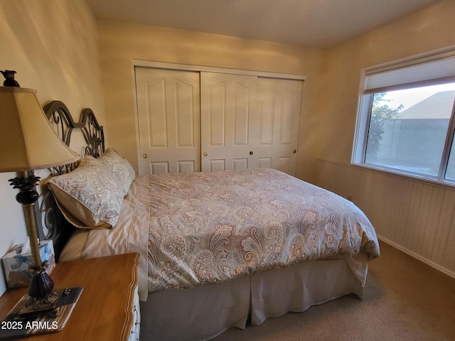 carpeted bedroom with a closet