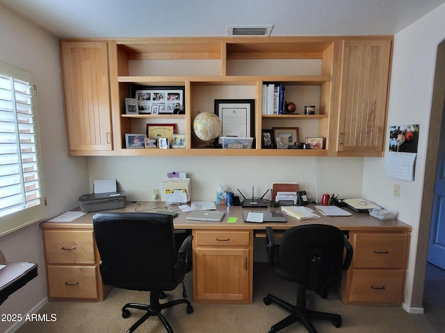 office area featuring visible vents and baseboards