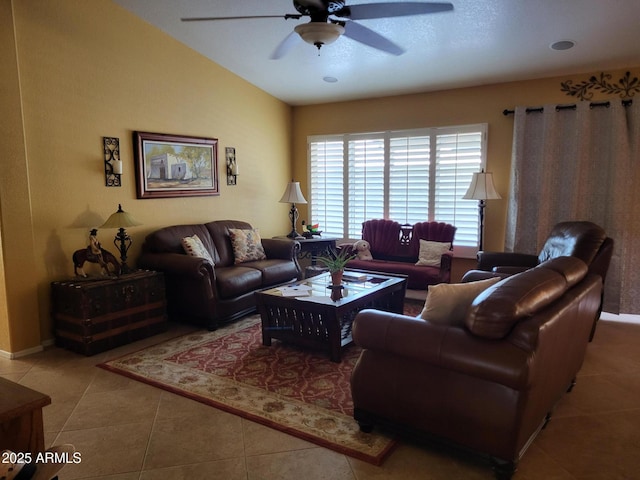 tiled living area featuring vaulted ceiling and ceiling fan