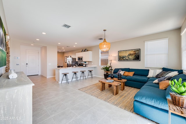 living room featuring light tile patterned floors