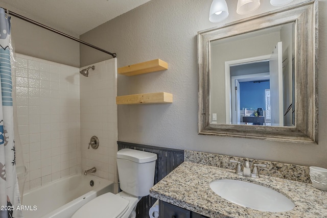5911 E Evergreen St, Mesa, AZ 85205 - bathroom with shower / bathtub combination with curtain, vanity, wainscoting, and a textured wall