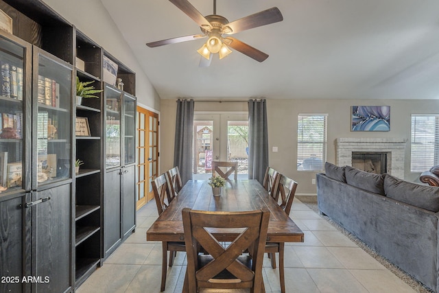 5911 E Evergreen St, Mesa, AZ 85205 - dining room featuring french doors, lofted ceiling, healthy amount of natural light, and light tile patterned flooring