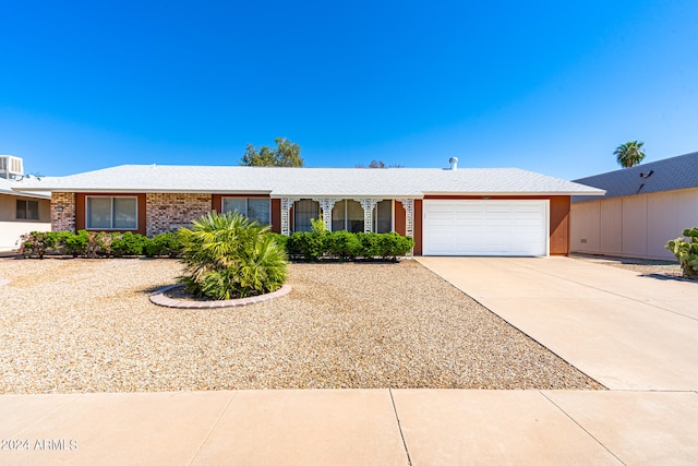 single story home with a garage