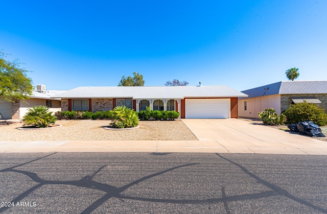 single story home featuring a garage