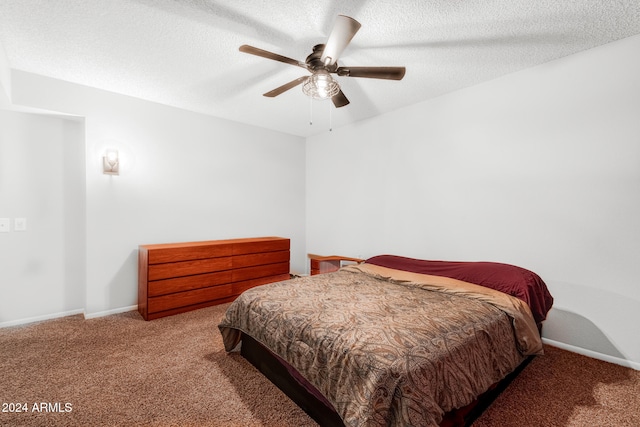 bedroom featuring carpet floors, a textured ceiling, and ceiling fan