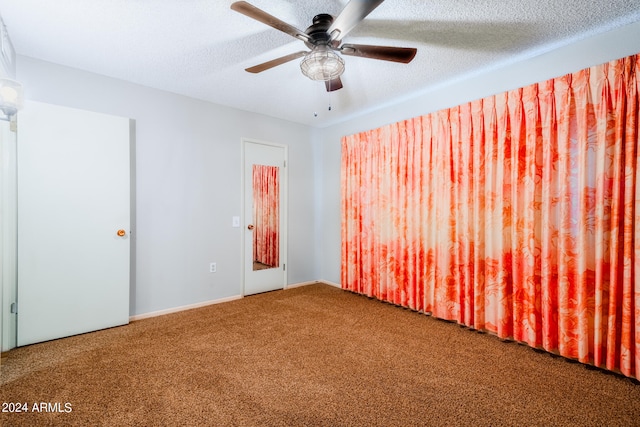 unfurnished room with carpet, a textured ceiling, and ceiling fan