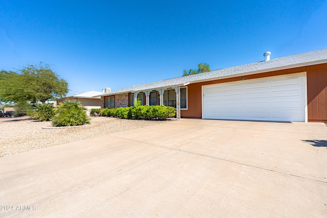 ranch-style house featuring a garage