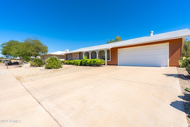 single story home with a garage