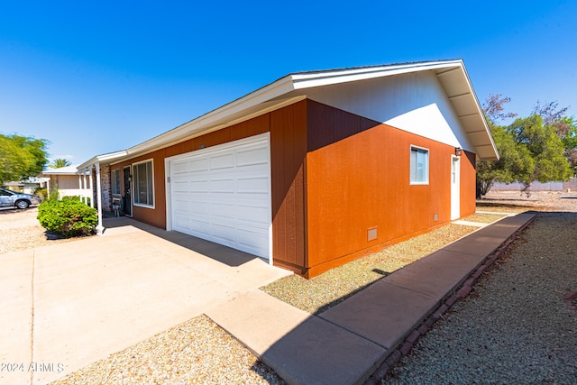 view of property exterior with a garage