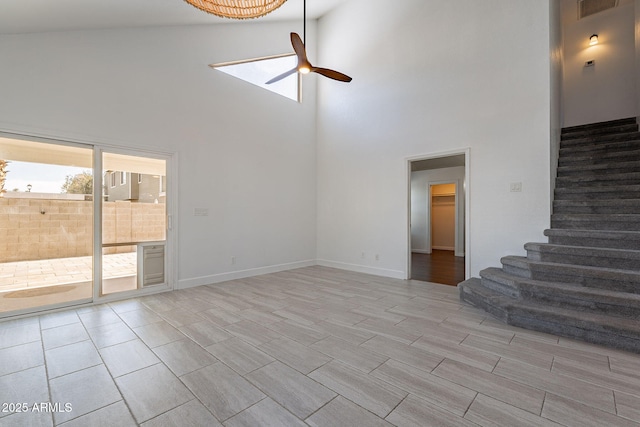 unfurnished living room featuring ceiling fan