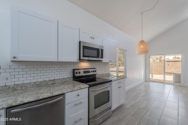 kitchen with tasteful backsplash, light stone countertops, appliances with stainless steel finishes, and white cabinets