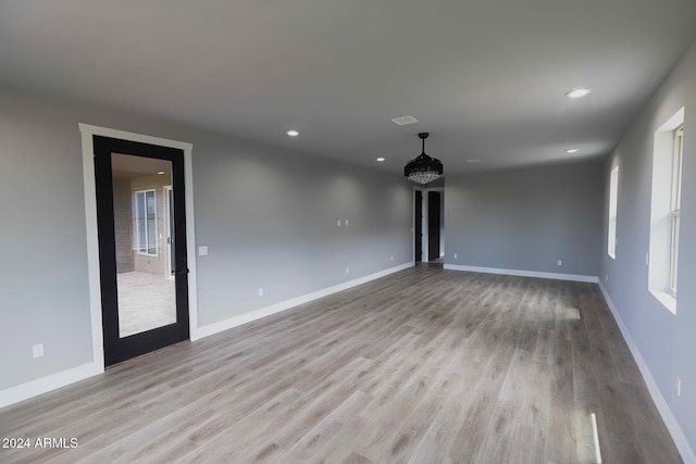 unfurnished living room featuring light hardwood / wood-style flooring